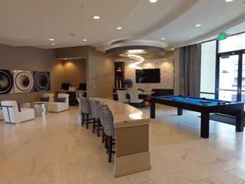 a recreation room with a pool table and lounge area  at Avant & Avant II, Carmel, Indiana